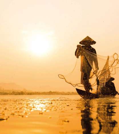 Fisherman Net Casting On The Boat On Morning Time Sunrise, Asia
